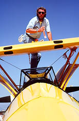 thumbnail link to photograph of Steve on top of his yellow vintage plane Santa Paula airport