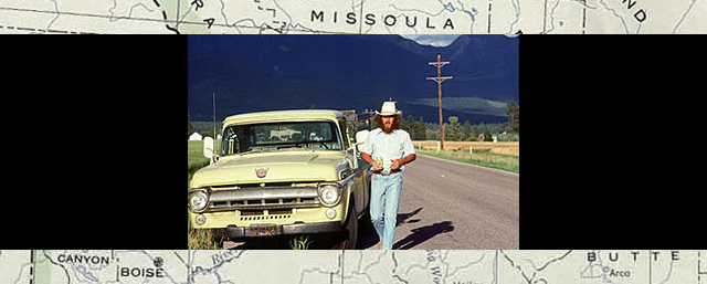 Steve McQueen in Montana by truck by roadside
